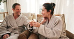 Love, cheers or couple in spa with champagne, partner vacation or bonding trip for anniversary. Smile, toast or mature people in resort with drink, connection or happy moment on honeymoon celebration