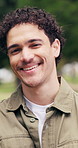 Face, man and relax at park with smile, holiday chill and good mood in nature with free time. Wellness, happy person and laugh outdoor for weekend break, fresh air or positive attitude on solo outing