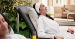 Woman, relax and spa at resort with holiday, peaceful trip and hospitality at luxury accommodation. Calm, mature person and rest at hotel with wellness retreat, self care or serenity with eyes closed