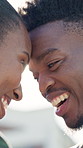 Outdoor, bonding and couple with forehead touch, love and laugh with partner and happiness on break. Black people, smile and connection with spouse on weekend, flare and relationship commitment