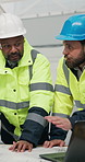 Engineer, teamwork and men with blueprint in building, brainstorming or discussion with electrician. Construction worker, collaboration and people with paperwork, point and planning for renovation