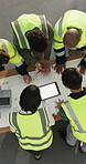 Engineer, team and meeting with tablet screen in building, above and plan for property development. Construction worker, collaboration and people with paperwork, mockup space and discussion with tech