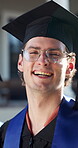 Happy, face and man at graduation ceremony for college degree, education milestone and pride. Male person, university graduate and success or achievement of goals, future and academic excellence