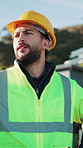 Thinking, construction and man outdoor for planning, inspection and idea for property development. Civil engineering, architecture and person with helmet, ppe and reflection for remodeling project