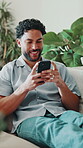 Laugh, phone and man on couch with texting, online communication and comic post on social media. Happy, digital and person in house with technology, funny message and meme reaction on chat app.
