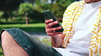 Hands, phone and man laugh at park with social media meme, text or notification on holiday break. Mobile, outdoor or person with app for funny joke, communication or online connection on vacation