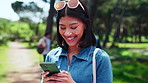 Text, laugh or university student on campus with phone, online chat or funny post on social media. Digital, typing or happy woman outdoor with tech, college meme or comic reaction on gen z blog.