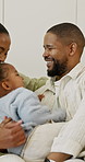 Love, parents and kid on sofa with hug, parent security and bonding together on weekend break. Laugh, black family and child in home with running, happy moment and connection in healthy relationship.