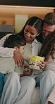 Excited, jump and parents with children on sofa for bonding, relax and weekend break with snack. Family, home and kids with mom, dad and hug for love, fun and happy with popcorn for movie night