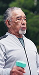 Fitness, outdoor and old man with dumbbells, breathing and physical activity for wellness or workout. Training, routine and elderly person with exercise equipment, endurance and active at park