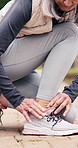 Senior, woman and hands with ankle pain in park for outdoor workout accident, discomfort or strain. Active, elderly or female person with sore leg, ache or foot for muscle tension, sprain or injury
