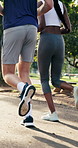 Running, back and legs of people in park for fitness, cardio workout or training together for health. Runner, challenge and men with women for exercise, active and endurance for wellness outdoor