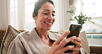 Spa, phone and mature woman with smile for hospitality rating, social media or check in at lodge. Happy person, technology and relax in waiting room with mobile app, luxury accommodation and bathrobe