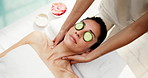 Hands, woman and massage at salon with cucumber, reduce puffiness and treatment of deep tissue. Above, masseuse and mature person at retreat with vegetable, muscle stiffness and therapeutic wellness