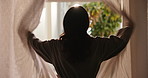 Woman, window and thinking with morning sunshine, wake up and luxury bedroom in hotel room. Back, flare and female person in bathrobe for accommodation, open curtain and vacation or holiday stay