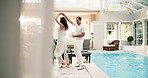 Happy, couple and holding hands at resort with dance, romance and support on anniversary getaway. Smile, mature people or twirl at retreat for celebration, rhythm and romantic partner for holiday fun
