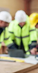 Blur, meeting and people with laptop for construction planning and blueprint for building design. Engineering team, warehouse and workers with tech, paperwork and compliance report for renovation