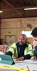 Woodworking, manager and men with tablet in warehouse, discussion and planning for furniture design. Carpenter, teamwork and people with paperwork in meeting, brainstorming or colleagues with tech