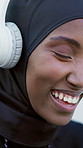 Black woman, laugh and headphones in city for fitness, streaming and podcast for exercise break. Happy, muslim person and relax outdoor for fresh air, listening to music and funny audio for training