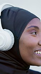 Thinking, black woman and headphones in city for fitness, streaming and podcast for exercise. Happy, muslim person and relax outdoor with vision, listening to music and motivation audio for training