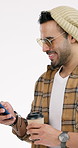 Man, laugh and drinking coffee in studio with phone, funny social media post and watch comedy video. Happy, person and beverage with tech for internet humor, online meme and joke on white background.