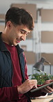 Smile, man and logistics at startup with tablet, stock availability and confirm order for delivery. Happy, person and typing in warehouse with tech, supply chain and supplier information for shipping