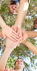 Below, students and hands together in college with celebration, education and environmental society. Face, happy people and stack outdoor in university with diversity, goals and success for eco club.