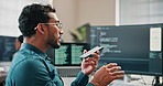 Phone, loud speaker and man with computer screen in office, software development or point at project. Programmer, online and person with mobile, voice note and communication with contact in business