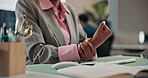 Hands, woman and wrist pain in office with computer, typing and carpal tunnel from programming. Person, discomfort and tech in workplace with muscle stiffness, employee injury and burnout from coding