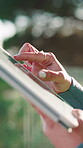 Scroll, message and hands with tablet, outdoor and communication with contact on social media or app. Browsing, online and person with technology, internet connection and networking on website