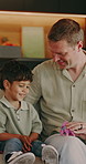 Father, playing and child at house with toys, imagination and creative roleplay for interaction. Smile, man and kid in living room with dinosaur, pretend games and prehistoric fantasy for family time