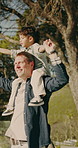 Shoulder, ride and dad with child, holding hands and spinning with son on weekend or dance together. Happy family, man and play with kid on break, love and connection with father on rooftop at home