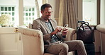 Business, hotel and man in lobby with phone for networking, internet and travel update for work trip. Hospitality, hands and person on cellphone for conference schedule, website and typing email