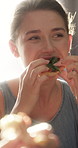 Eating, pizza and happy woman in home for fast food, dining together or social gathering. Female person, smile or bite with dairy snack, taste or meal for delicious pastry, cuisine or recipe in house