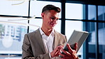 Finance, happy and businessman on tablet in lobby for investment, foreign exchange and stock market. Office, corporate and person on tech for financial report, liquidity management and forecasting