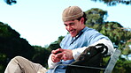 Texting, laugh and university student in park with phone, online chat and funny post on social media. Digital, humor or happy man outdoor with technology, college meme or comic reaction on gen z blog
