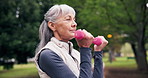 Exercise, dumbbells and senior woman at park for fitness, strength training or workout for health. Bicep curls, elderly person and weightlifting outdoor for muscle growth, breathing or retirement