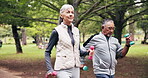 Fitness, walking and old couple with dumbbells at park for workout, healthy lifestyle and exercise. Senior man, woman and together outdoor for retirement wellness, cardio and interracial relationship