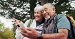 Hiking, direction and old couple in nature with phone, conversation and search route for adventure. Happy, married senior people and tech outdoor for location, navigation or digital map for trekking.
