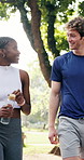 Walking, talking and friends in park for fitness, cardio workout and training together for health. Sports, conversation and men with women for exercise, active and wellbeing for wellness outdoor