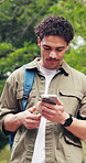 Walking, phone and man outdoor at university for social media, chat or travel to class for education. Happy, college and student on cellphone for internet, website and message for learning or study