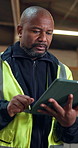 Black man, engineer and tablet at site for construction, research and inspection for architecture. Mature person, walking and reading at workshop with digital, quality assurance and building progress