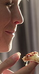 Hungry, woman and eating pizza in home for lunch, snack and fast food on weekend break. Bite, slice and happy person with cheese at house, smile and takeaway dinner with Italian cuisine satisfaction
