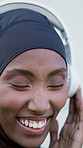 Smile, black woman and headphones outdoor for fitness, streaming and podcast for exercise break. Happy, muslim person or relax in city for fresh air, listen to music and motivation audio for training