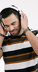 Dance, streaming or man in studio with headphones, song connection or listening to music playlist. Digital, groove or happy person with tech, feeling beat or radio subscription on white background.