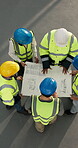 Builder, team and meeting with floor plan in building, above or discussion for property development. Construction, collaboration and people with blueprint, brainstorming and talking with electrician