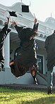 Back, students and throwing cap at graduation, ceremony and achievement for degree completion. People, tossing and hat at university for celebration, academic success and award for learning milestone