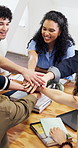 Happy, students and hands together in college with success, data and good grade for business school. Excited, people and celebration in university class with commerce faculty, stats and pass project.