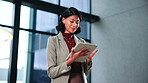 Woman, lawyer and reading in office with tablet, email witness and new evidence for court case. Smile, attorney and review at law firm with tech, upcoming trial and testimony for proceedings verdict