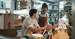 Small business, advice or team on laptop for logistics training, order processing or route planning. Explain, new hire and owner with tech for stock levels, delivery scheduling and system integration